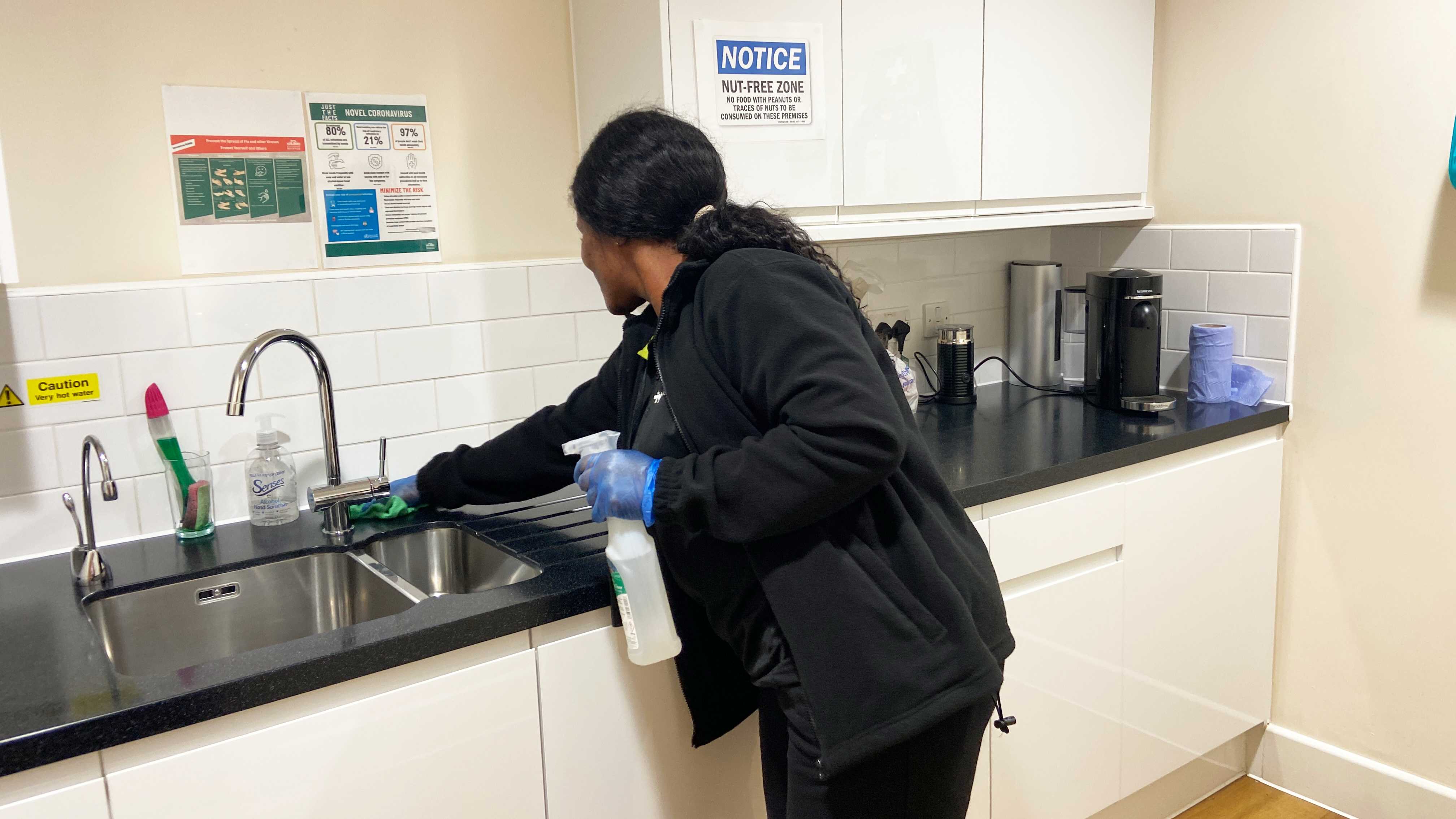 Operative deep cleaning a workplace kitchen